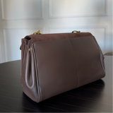 Vintage-Inspired Brown Suede Shoulder Bag with Flap Closure